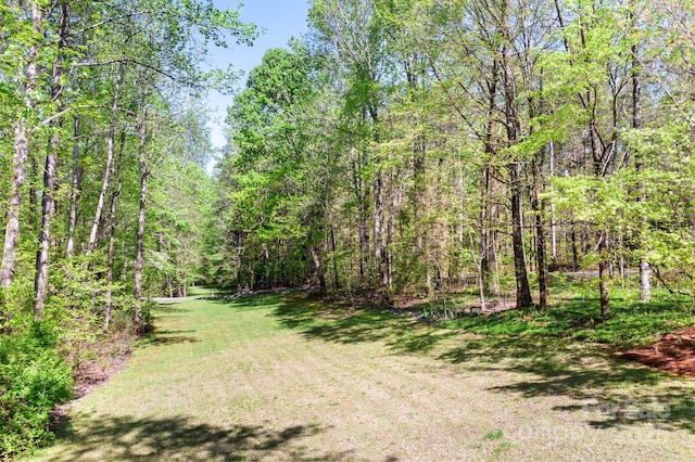 view of yard with a forest view