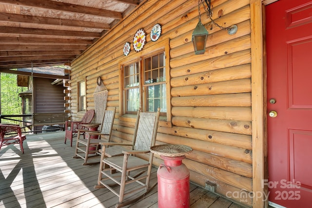 wooden terrace featuring a porch
