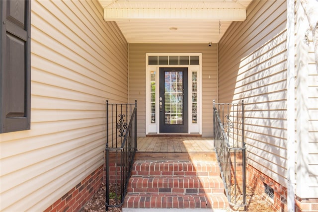 doorway to property with crawl space and a porch