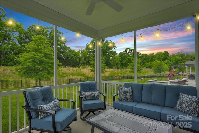 sunroom featuring an outdoor hangout area, ceiling fan, and a healthy amount of sunlight