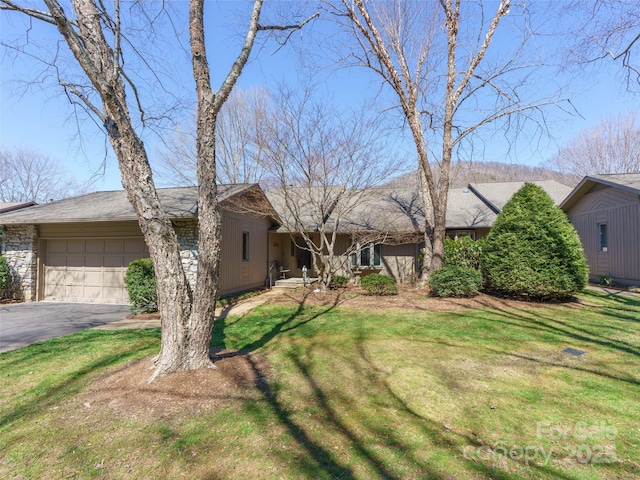 12 Clubside Dr, Asheville, NC 28804 - view of front facade with aphalt driveway, a garage, and a front yard