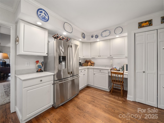 12 Clubside Dr, Asheville, NC 28804 - kitchen featuring white cabinets, ornamental molding, stainless steel refrigerator with ice dispenser, and light wood-style floors