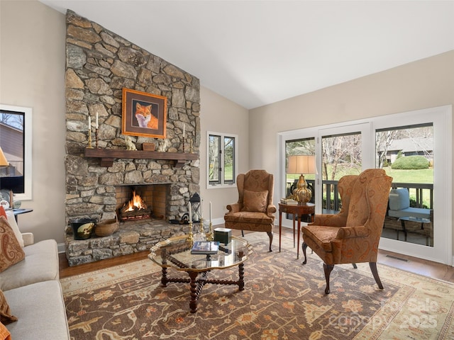 12 Clubside Dr, Asheville, NC 28804 - living area featuring a stone fireplace, baseboards, visible vents, and wood finished floors