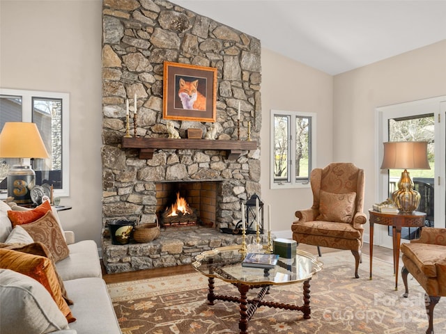 12 Clubside Dr, Asheville, NC 28804 - living room with lofted ceiling, a fireplace, wood finished floors, and a healthy amount of sunlight