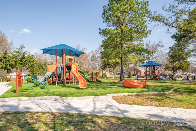 community jungle gym with a lawn