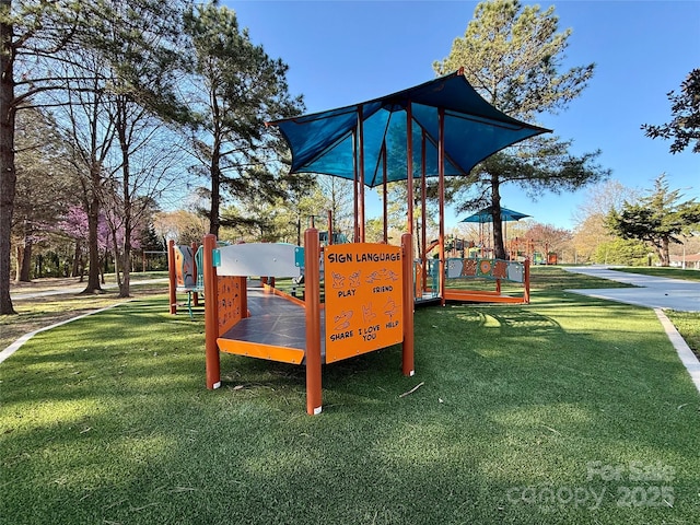 community playground featuring a lawn