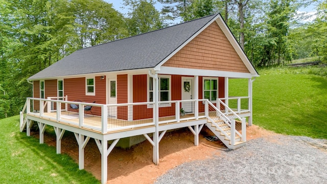 37 Garland Ball Dr, Alexander, NC 28701 - view of front of house with a front yard, a shingled roof, and view of wooded area