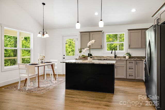 37 Garland Ball Dr, Alexander, NC 28701 - kitchen featuring freestanding refrigerator, vaulted ceiling, gray cabinetry, a sink, and recessed lighting