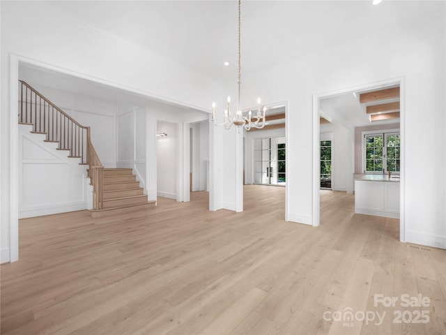 3212 Willow Oak Rd, Charlotte, NC 28209 - unfurnished dining area featuring light wood-style floors, stairs, a chandelier, ornamental molding, and baseboards