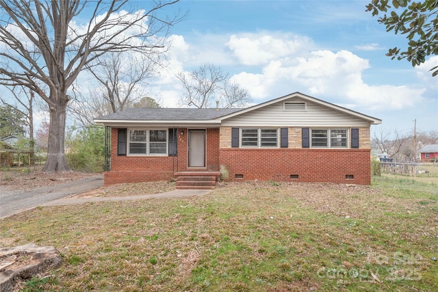 ranch-style home featuring a front yard, fence, crawl space, and brick siding