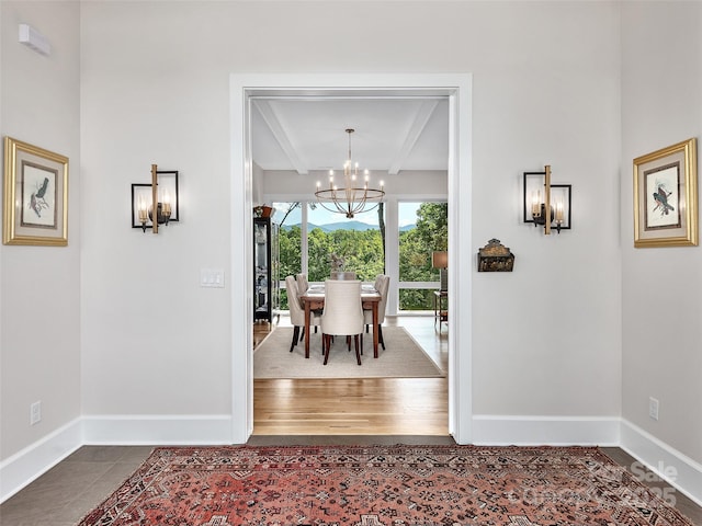 162 Riverbend Forest Dr, Asheville, NC 28805 - unfurnished dining area with an inviting chandelier, dark tile patterned flooring, baseboards, and beamed ceiling