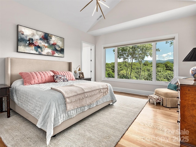 162 Riverbend Forest Dr, Asheville, NC 28805 - bedroom featuring high vaulted ceiling, visible vents, baseboards, wood finished floors, and a ceiling fan