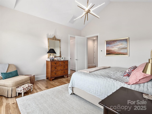 162 Riverbend Forest Dr, Asheville, NC 28805 - bedroom featuring baseboards, high vaulted ceiling, and wood finished floors
