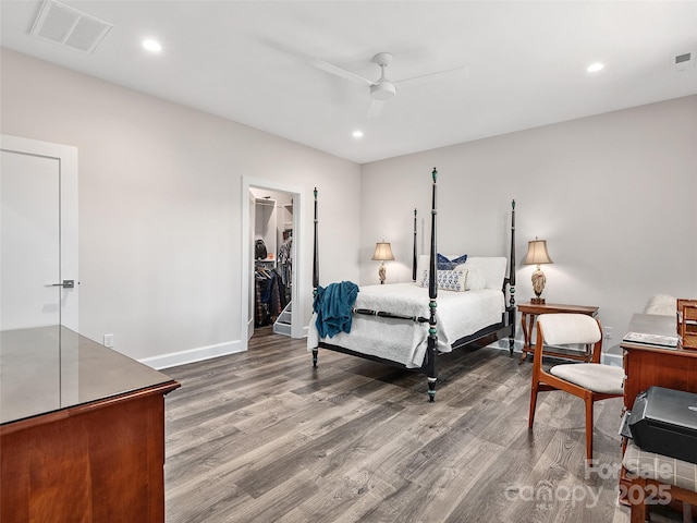 162 Riverbend Forest Dr, Asheville, NC 28805 - bedroom featuring wood finished floors, a walk in closet, baseboards, visible vents, and recessed lighting