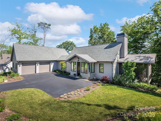 162 Riverbend Forest Dr, Asheville, NC 28805 - view of front of home featuring roof with shingles, driveway, a front lawn, a garage, and a chimney