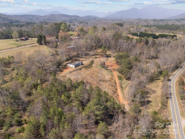 2311 Freemantown Rd, Lake Lure, NC 28746 - bird's eye view featuring a wooded view and a mountain view