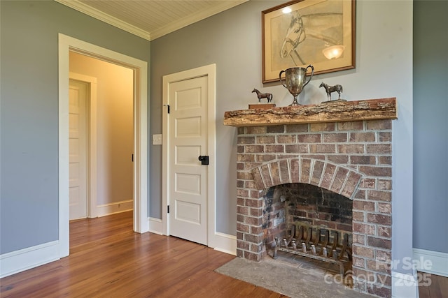 570 Lambs Grill Rd, Rutherfordton, NC 28139 - living area with baseboards, wood finished floors, ornamental molding, and a brick fireplace