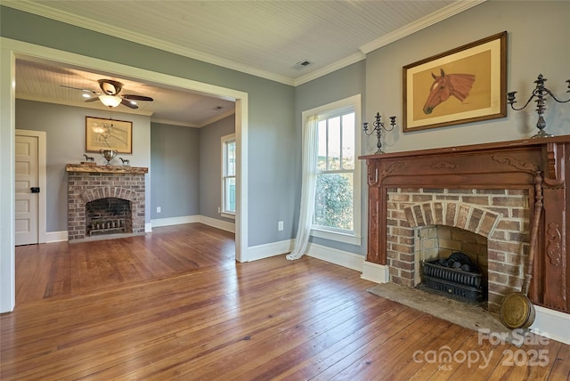 570 Lambs Grill Rd, Rutherfordton, NC 28139 - unfurnished living room featuring ornamental molding, baseboards, hardwood / wood-style flooring, visible vents, and a fireplace
