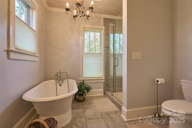 570 Lambs Grill Rd, Rutherfordton, NC 28139 - full bathroom with crown molding, a shower stall, toilet, a freestanding tub, and a notable chandelier