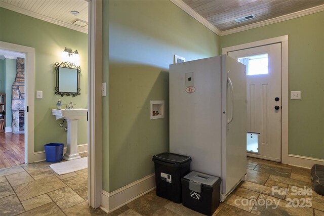 570 Lambs Grill Rd, Rutherfordton, NC 28139 - entrance foyer with visible vents, crown molding, baseboards, wooden ceiling, and stone tile floors