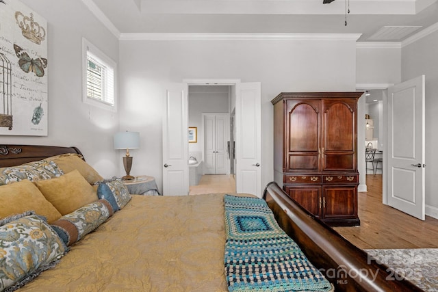 bedroom featuring wood finished floors and crown molding