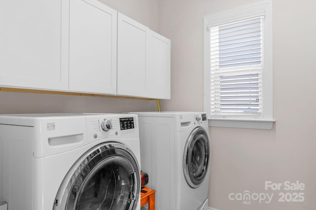 laundry room featuring cabinet space and washer and dryer