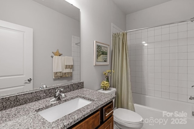 full bathroom with shower / tub combo, toilet, and vanity