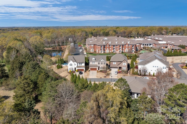 bird's eye view with a residential view and a view of trees