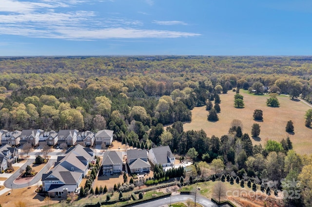 birds eye view of property with a residential view and a forest view