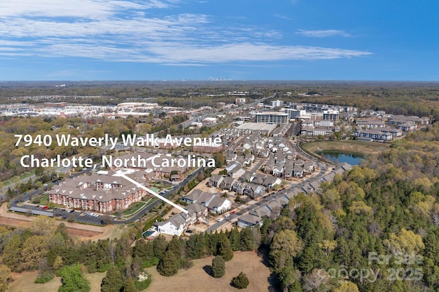 bird's eye view featuring a water view and a residential view