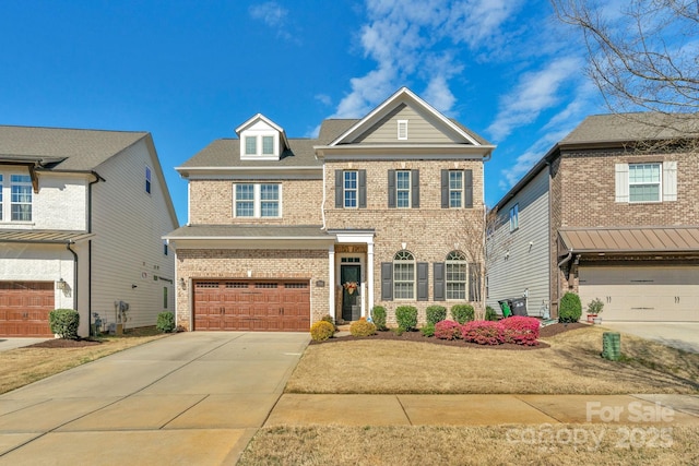 traditional-style home with an attached garage, concrete driveway, and brick siding