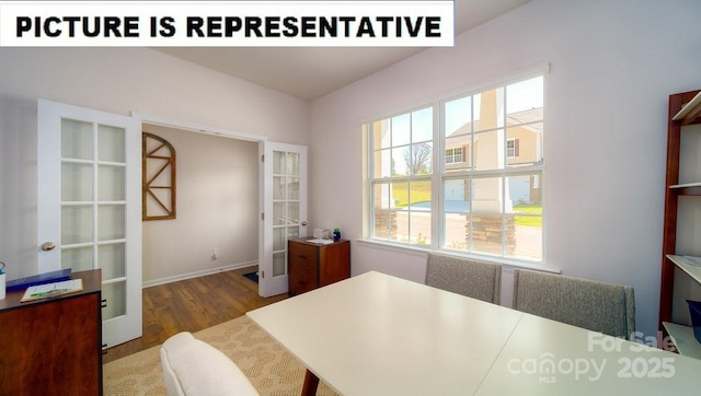 office space featuring french doors, baseboards, plenty of natural light, and wood finished floors
