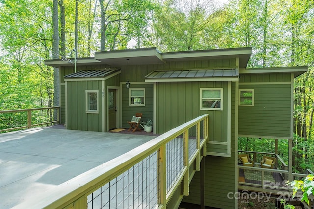 102 Kanawha Dr, Montreat, NC 28757 - back of house with board and batten siding, a standing seam roof, and metal roof