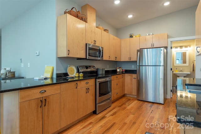 102 Kanawha Dr, Montreat, NC 28757 - kitchen with light wood-type flooring, recessed lighting, a sink, dark stone countertops, and appliances with stainless steel finishes