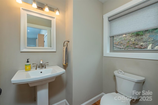 102 Kanawha Dr, Montreat, NC 28757 - half bathroom with toilet, baseboards, and a sink