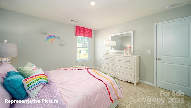bedroom featuring visible vents, baseboards, and light carpet