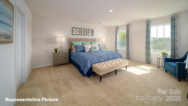 carpeted bedroom featuring recessed lighting and baseboards