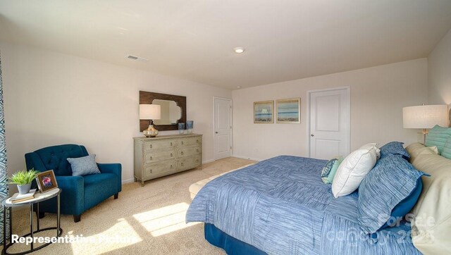 bedroom featuring baseboards, visible vents, and light carpet