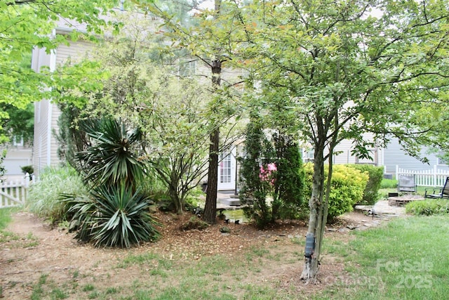 view of side of home with fence