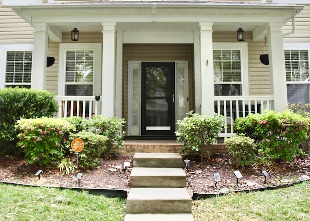 entrance to property with covered porch