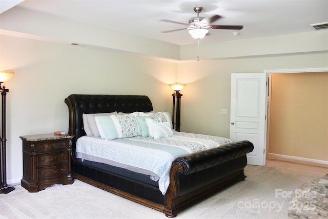 carpeted bedroom with visible vents, baseboards, and ceiling fan