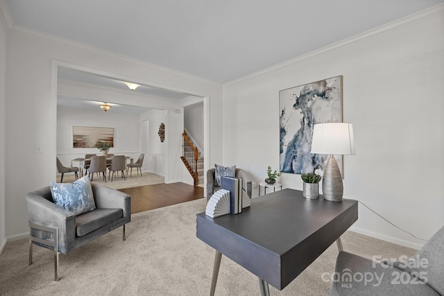 carpeted home office featuring ornamental molding and baseboards