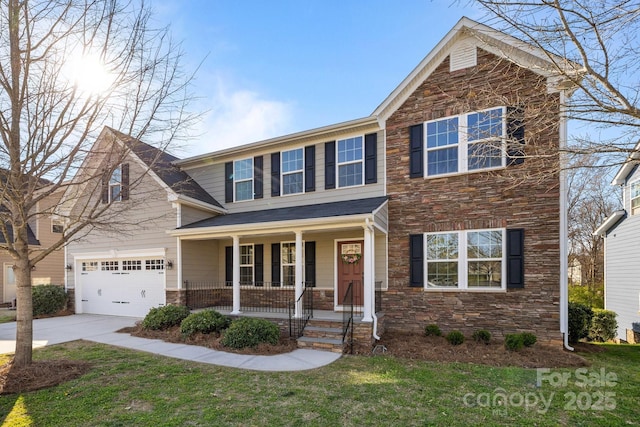 view of front of home featuring a porch, a front yard, a garage, stone siding, and concrete driveway