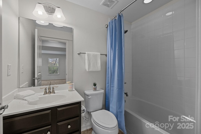 bathroom featuring visible vents, shower / bath combo with shower curtain, toilet, and vanity