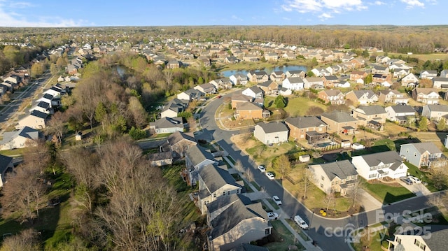 aerial view with a residential view and a water view