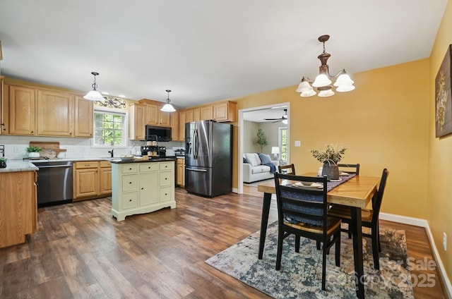 9711 Pine Tree Rd, Norwood, NC 28128 - kitchen with light brown cabinetry, dark wood-style floors, baseboards, decorative backsplash, and appliances with stainless steel finishes