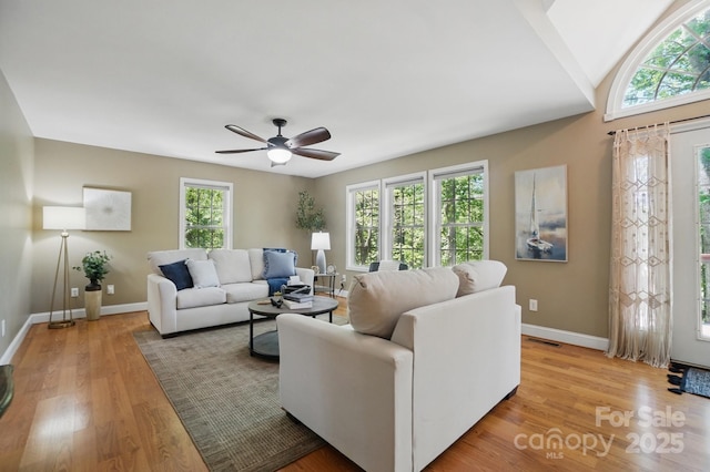 9711 Pine Tree Rd, Norwood, NC 28128 - living room featuring light wood finished floors, baseboards, ceiling fan, and visible vents