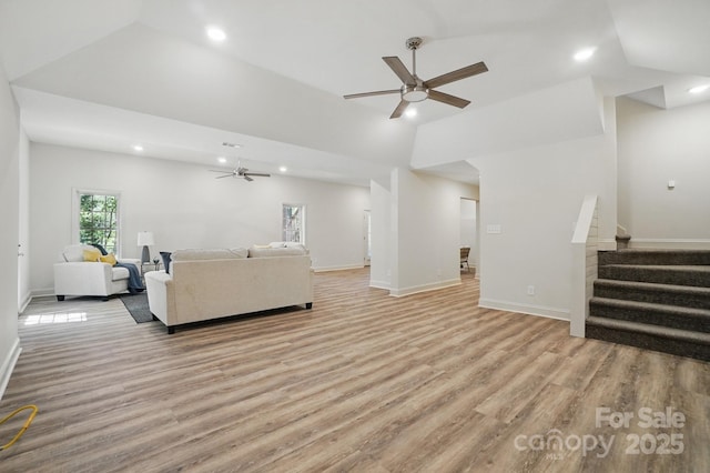9711 Pine Tree Rd, Norwood, NC 28128 - living room with wood finished floors, recessed lighting, stairs, and ceiling fan