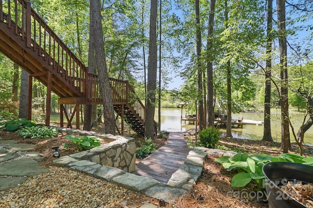 9711 Pine Tree Rd, Norwood, NC 28128 - view of yard featuring a boat dock, a water view, and stairway