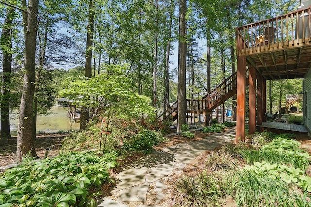 9711 Pine Tree Rd, Norwood, NC 28128 - view of yard featuring a wooden deck and stairway